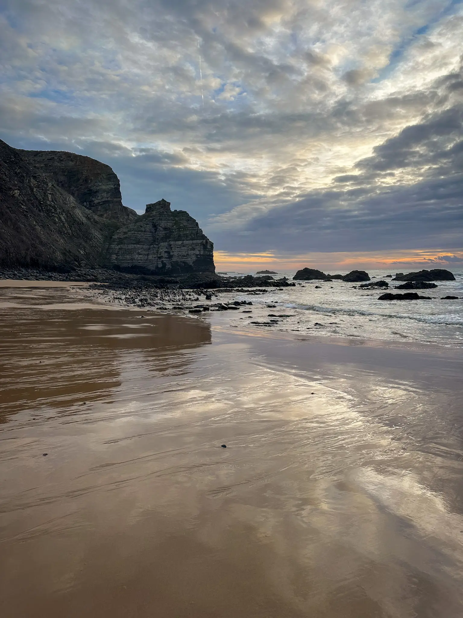 steep and rocky hills over praia da arrifana