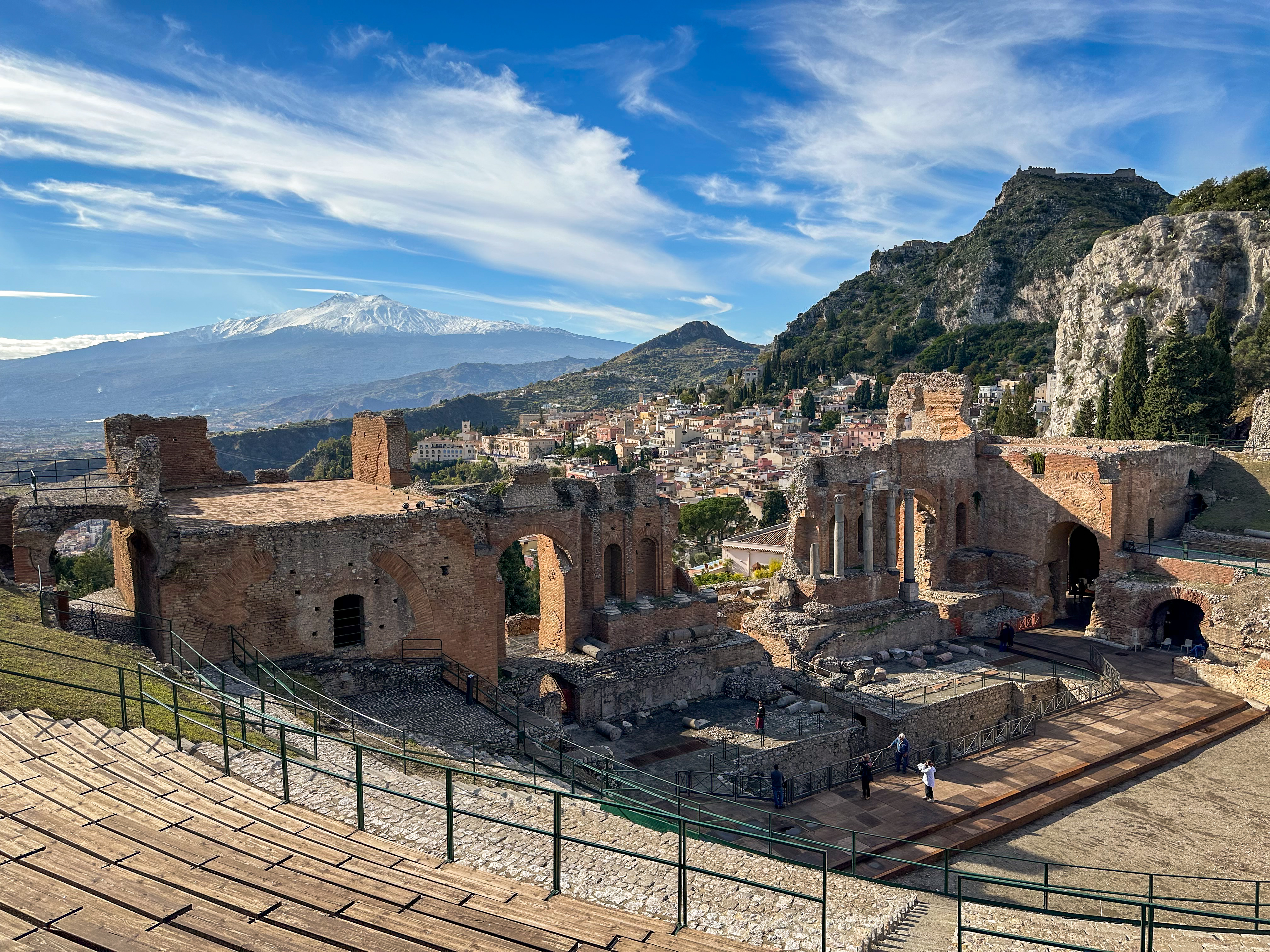 view of Etna from the ancient theater in taormina