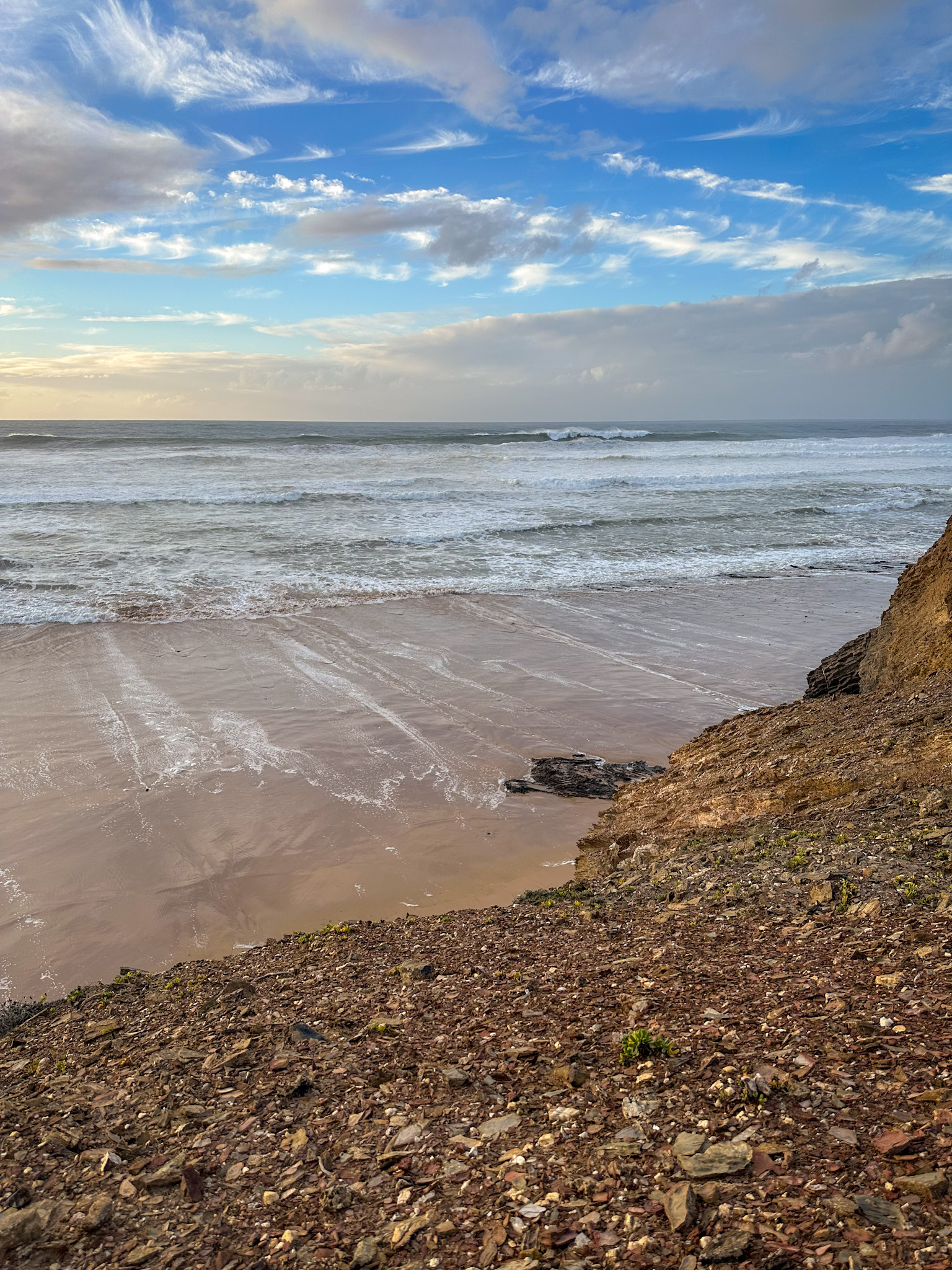 view towards the atlantic from the top of the hill on the praia de vale figueiras